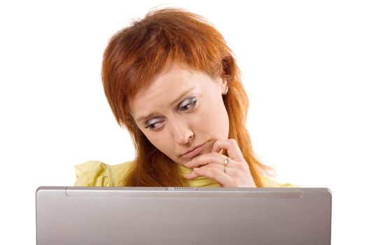 Thinking woman sitting with computer isolated