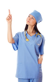 Young female doctor pointing finger upwards isolated on white background