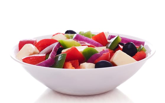 Fresh vegetables salad on plate, isolated on a white background.