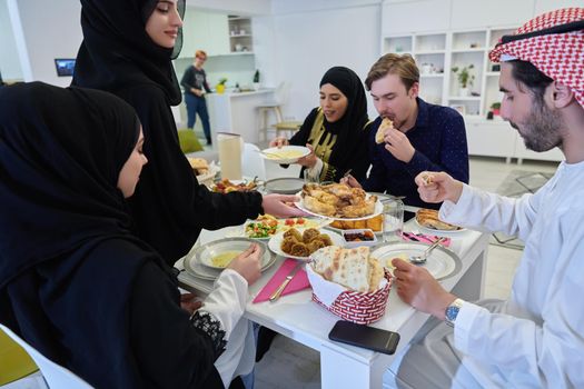 Muslim family having iftar together during Ramadan. Arabian people gathering for traditional dinner during fasting month.
