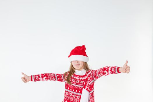 Photo portrait of kid dancing keeping hands up over head wearing red christmas sweater isolated on blue color background