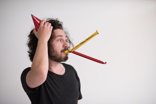 young man on party celebrating new year with falling confetti