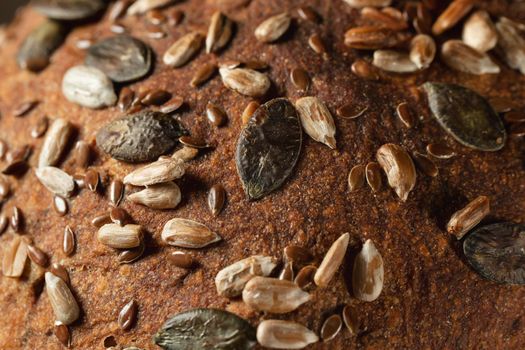 Close-up surface of homemade whole grain bread, food background, texture.