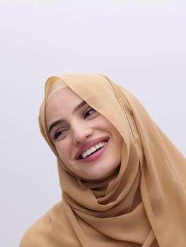 Portrait of young muslim woman wearing hijab isolated on white background. Fashionable and modern Islamic dress