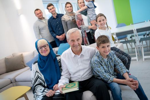 several generations portrait of happy modern muslim family before iftar dinner during ramadan feast at home