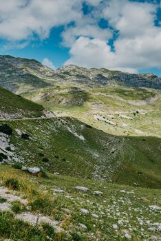 Mountain valley during sunrise. Natural summer landscape. Mountain peak green nature scenery. trail on green hill landscape