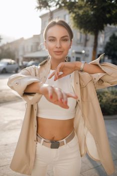 Portrait of a young fashion woman outdoors. High quality photo