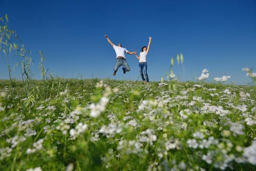 happy young couple in love have romance and fun at wheat field in summer