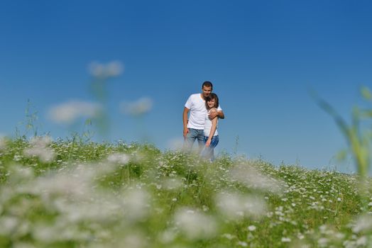 happy young couple in love have romance and fun at wheat field in summer