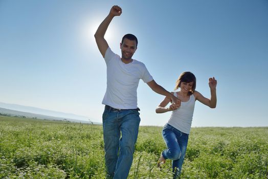 happy young couple in love have romance and fun at wheat field in summer