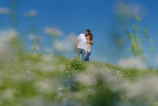 happy young couple in love have romance and fun at wheat field in summer