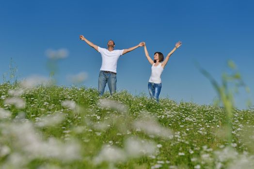 happy young couple in love have romance and fun at wheat field in summer