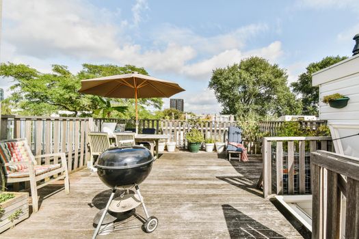 Exterior of the roof of the house with a delightful design with comfortable sun loungers and a table