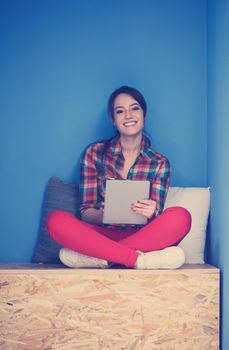 young woman in crative box working on tablet computer, startup business modern office room  interior