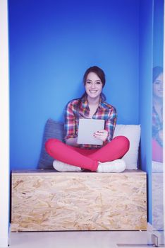 young woman in crative box working on tablet computer, startup business modern office room  interior