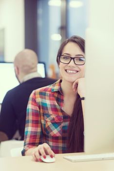 startup business, woman  working on dektop  computer at creative modern office relaxing and have fun