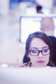 startup business, woman  working on dektop  computer at creative modern office relaxing and have fun