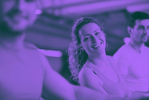 group of young people running on treadmills in modern sport  gym duo tone