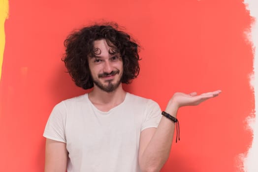 Portrait of a beautiful  young man with funny hair over color background with copyspace expressing different emotions