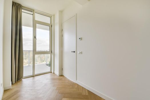 Mesmerizing room with floor-to-ceiling window with curtain
