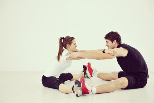 happy young people group in excercise and relax in  fitness club