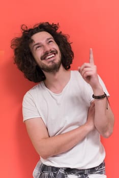 Portrait of a beautiful  young man with funny hair over color background with copyspace expressing different emotions