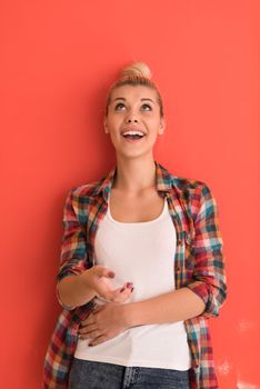 Portrait of a beautiful  young woman with hair bun over color background with copyspace expressing different emotions