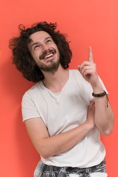 Portrait of a beautiful  young man with funny hair over color background with copyspace expressing different emotions