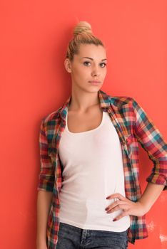 Portrait of a beautiful  young woman with hair bun over color background with copyspace expressing different emotions