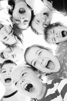 happy child group smilling together and hold heads very close