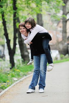 happy oung mother and daughter have fun outdoor 