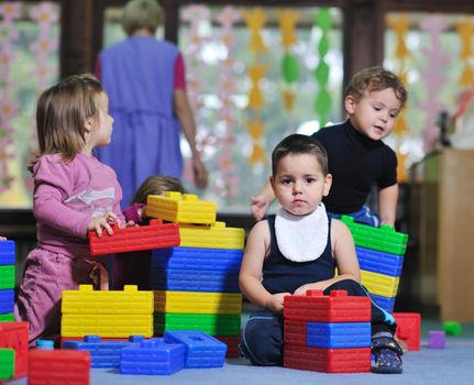 happy child kids group have fun and play at kindergarden indoor preschool education concept with  teacher