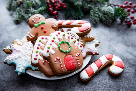 Christmas gingerbread in the plate and holiday decorations
