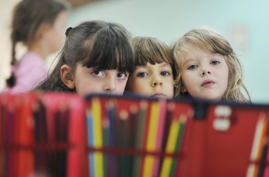 happy child kids group have fun and play at kindergarden indoor preschool education concept with  teacher