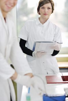 young students couple making test in bright labaratory