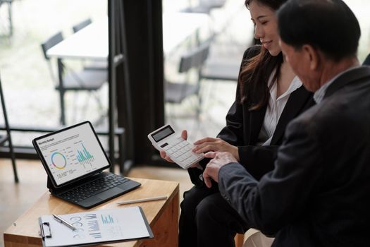 Senior asian man meeting financial adviser for investment, Financial advisor talks with client for financial planning after retirement.