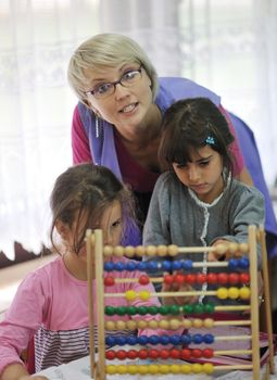 happy child kids group have fun and play at kindergarden indoor preschool education concept with  teacher