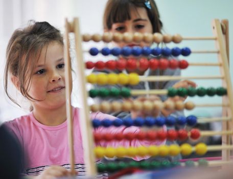 happy child kids group have fun and play at kindergarden indoor preschool education concept with  teacher