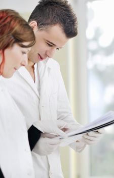 young students couple making test in bright labaratory