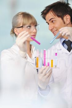 science and research biology chemistry an dmedicine  youn people couple in bright modern  lab