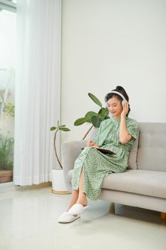 Ordinary female asian teen portrait at home sofa remote education concept. 