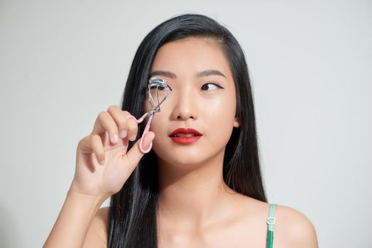 young attractive asian woman beauty image,eyelash curler
