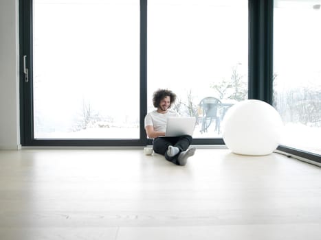 Real man Using laptop on the floor At Home  Enjoying Relaxing