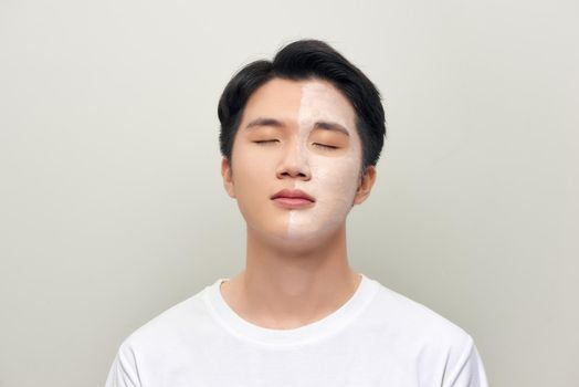 Male  wearing clay face mask beauty treatment.