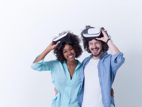 Happy multiethnic couple getting experience using VR headset glasses of virtual reality, isolated on white background