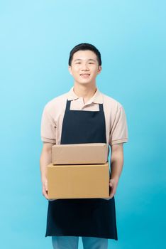 Entrepreneur smiling with happiness and success, holding boxes for delivery bread to customers, 