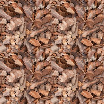 Seamless texture of pieces of pine bark. Background from pine chips close-up.