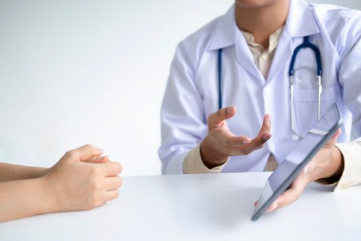 Doctor comforting patient at consulting room