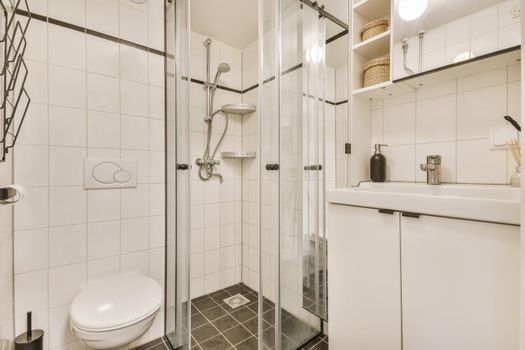 Cozy bathroom with shower and shelves with boxes