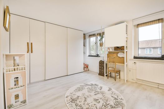 Cozy room with a large wall-to-wall wardrobe and a round rug